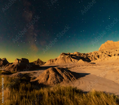 rugged rock formations under the clear night stars in Badlands national park in South Dakota