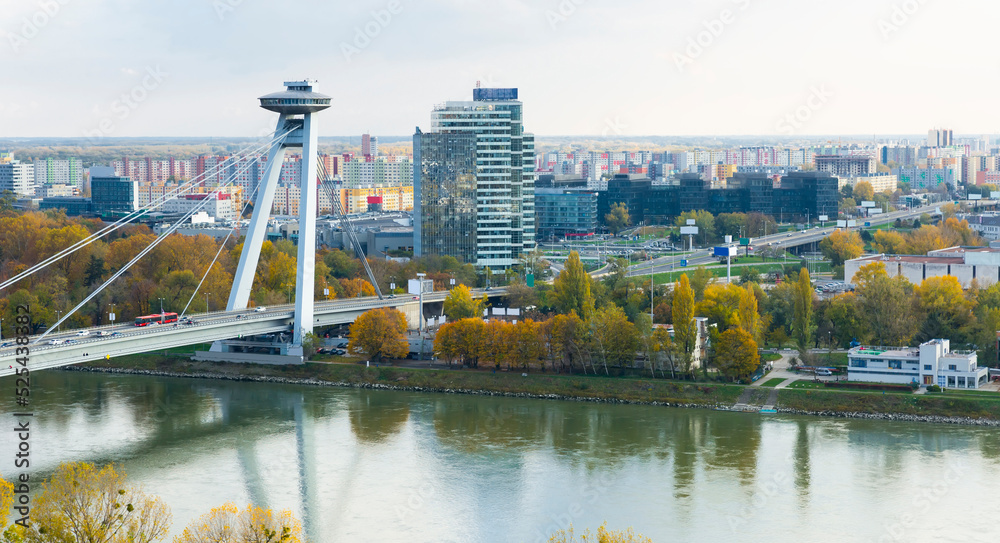 Obraz na płótnie Aerial view of Bratislava with famous Bridge SNP in autumn cloudy day w salonie