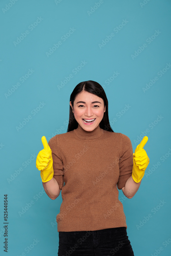 Happy glad and cheerful asian houseworker from chores thumbs up wearing yellow gloves for hand safety, Housewife worker, Cleaning home concept, Smiling satisfied and optimistic woman Happy glad and cheerful asian houseworker from chores thumbs up wearing yellow gloves for hand safety, Housewife worker, Cleaning home concept, Smiling satisfied and optimistic woman