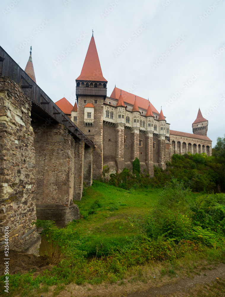 Impressive landscape with medieval Corvin Castle on elevated rock, Hunedoara, Romania