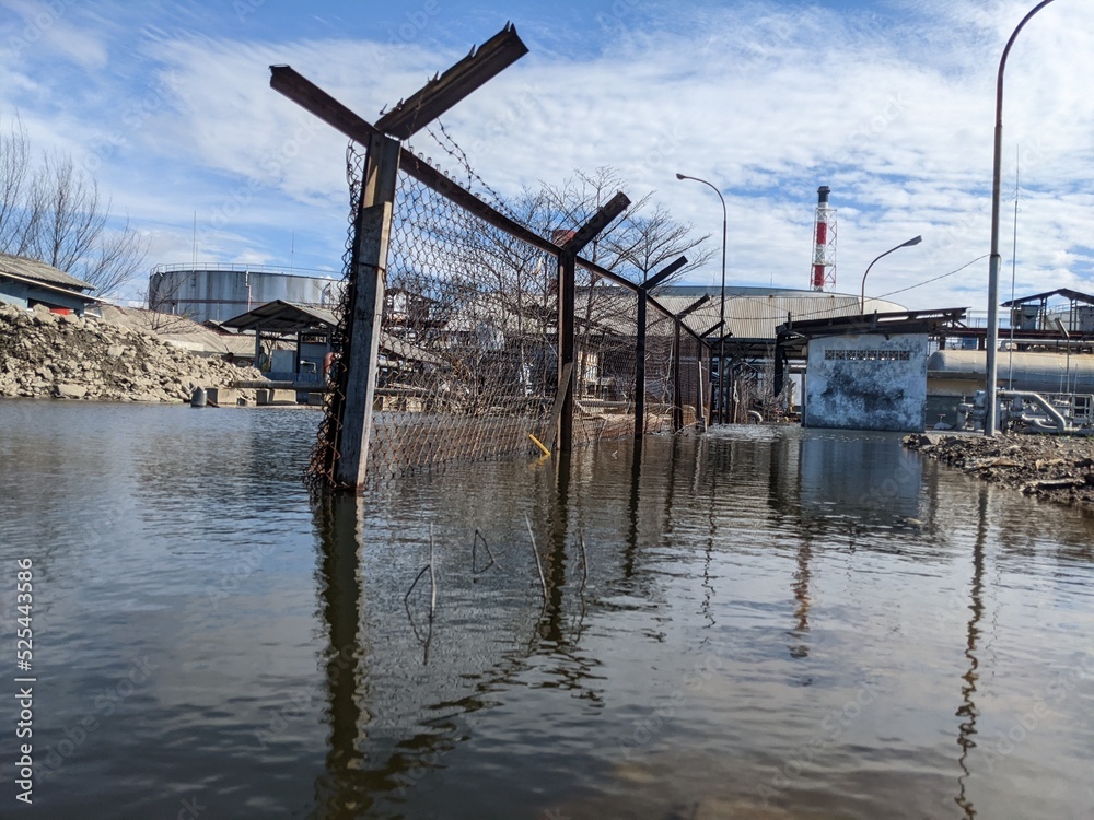 Landscape of abandoned power plant when flooding disaster. The photo perfect for safety poster and disaster background. 