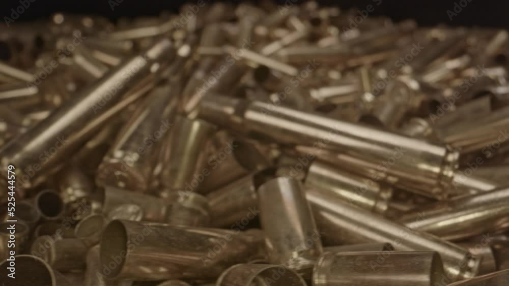 Close dolly of fired shell cases of several calibers and firearms Close dolly of fired shell cases of several calibers and firearms