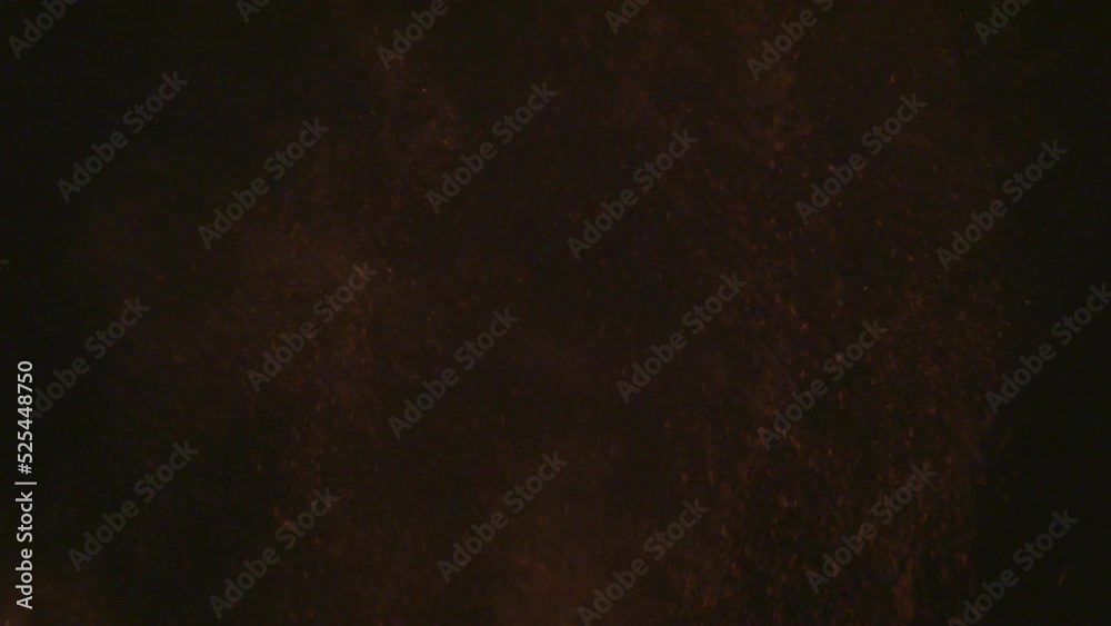 Mixing chocolate cubes with Fine cocoa powder, on a black background ...