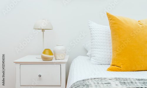 Closeup of bedside in a modern bedroom.