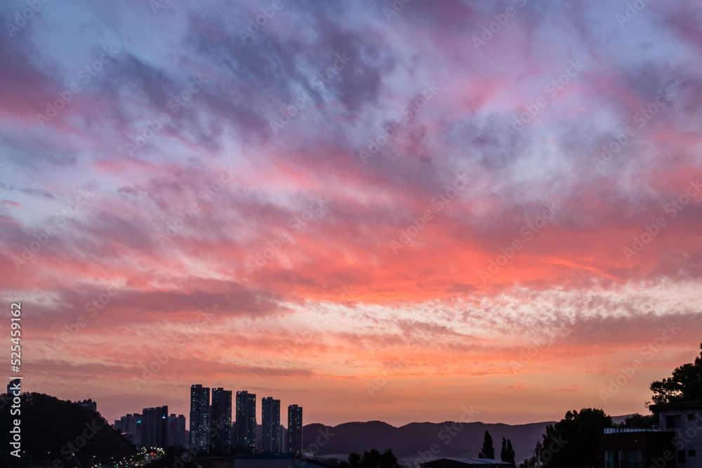 Dramatic pink and purple sunset clouds sky over the South Korea rural countryside