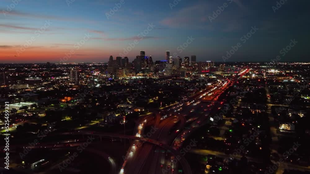 Aerial view towards the Illuminated night skyline of Houston city, dusk in Texas, USA Aerial view towards the Illuminated night skyline of Houston city, dusk in Texas, USA
