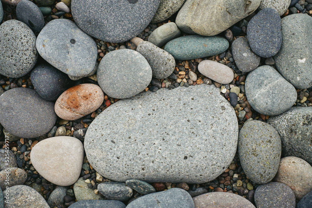 Pebble beach stones background, natural rounded gravel on the seashore nature background texture pattern Pebble beach stones background, natural rounded gravel on the seashore nature background texture pattern