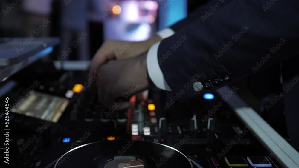 DJ playing music at a wedding party. DJ playing music at a wedding party.