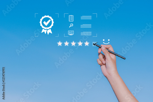 Hand writing working with sign 5 rating of the top service Quality assurance, Guarantee, Standards, ISO certification and standardization on the sky background.