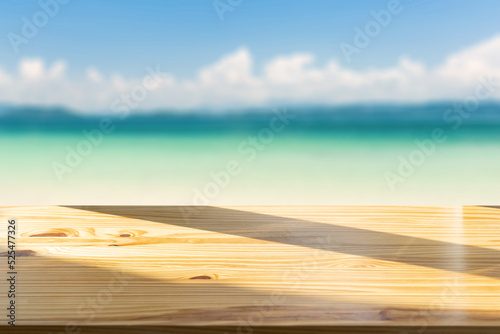 Φωτογραφία Top of the wood table in front of the white beach background