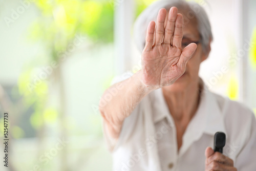 Old elderly woman making stop gesture with palm,campaign against family domestic violence,asian senior people raise hand to show sign,stop violence against women,physical abuse,human rights violation