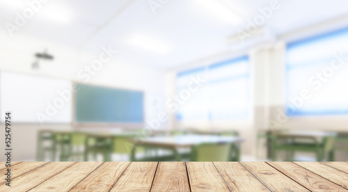 Empty wooden desk space platform with school classroom background for product display