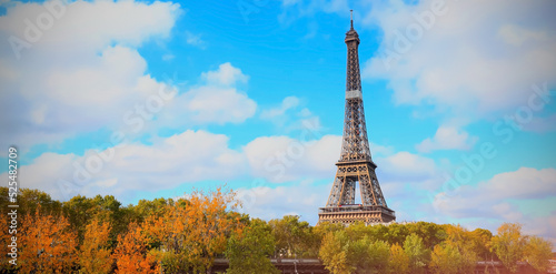 The Eiffel Tower, iconic Paris landmark as autumn trees park with blue sky scene at Paris ,France