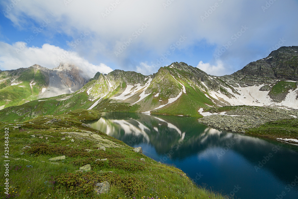 A beautiful mountain lake against the backdrop of a mountain range.