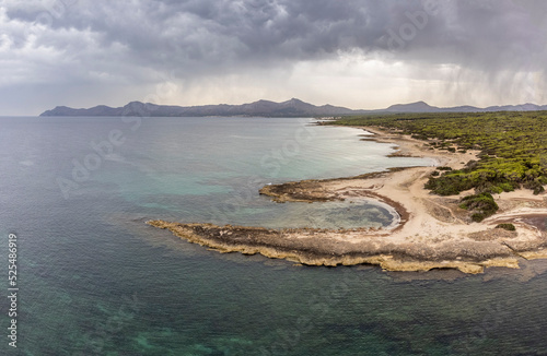 rain over the Sierra del Levant from Son Real-Punta des Patro, Majorca, Balearic Islands, Spain photo