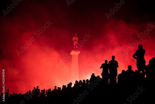 Red Star Football fans with torches and flags celebrating league title win next to monument Pobednik in Belgrade, Serbia 22.05.2022