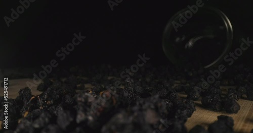 Wallpaper Mural Dried Ripe Wild Berries Dropping Falling Down, Scattered on Wooden Surface, Dolly Close Up Probe Lens View, Glass Jar in Dark Background Torontodigital.ca