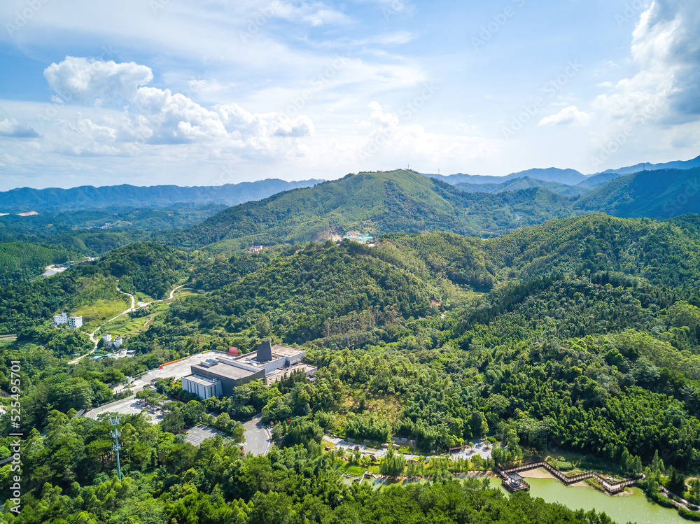 Aerial photography of green mountains, blue sky and white clouds on the outskirts of Guangxi