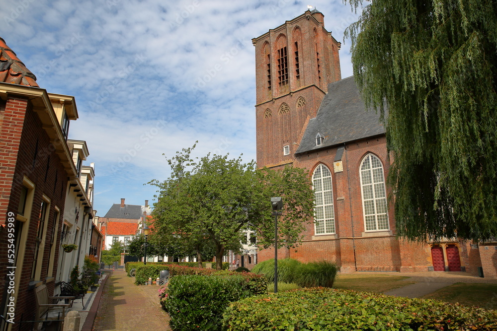Fototapeta premium The historic Nicolaas church (Nicolaaskerk) in Elburg, Gelderland, Netherlands, viewed from Zuiderwalstraat street