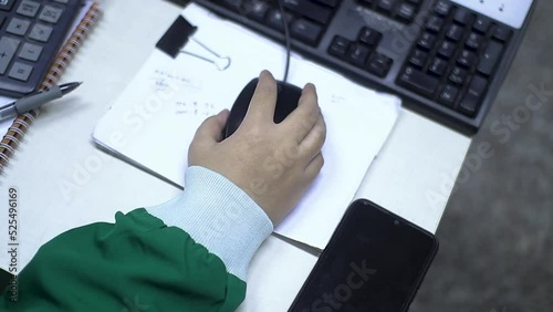 close up of hands at work holding a computer mouse