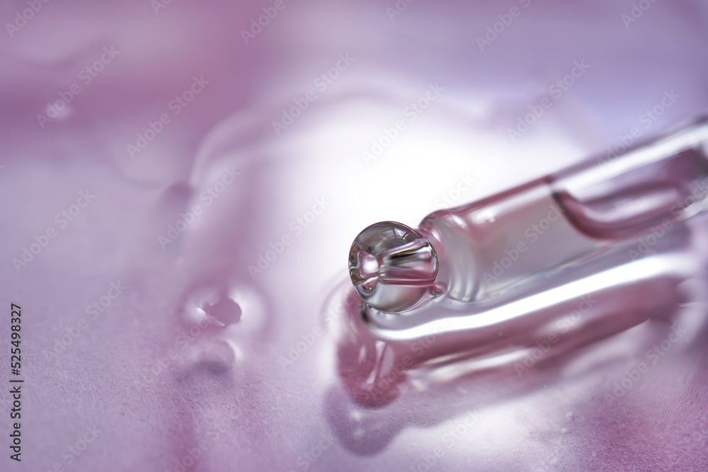 Dropper with serum or cosmetic oil on a pink background. Dropper with serum or cosmetic oil on a pink background.