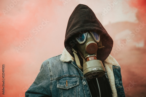 Person holding smoke bomb on street photo