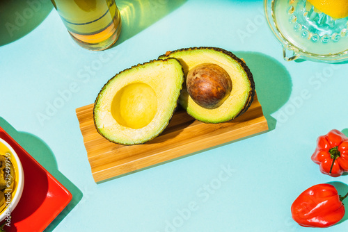 Fresh avocado on wooden board photo