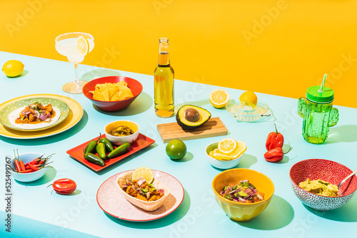 Table with assorted Mexican food and drinks