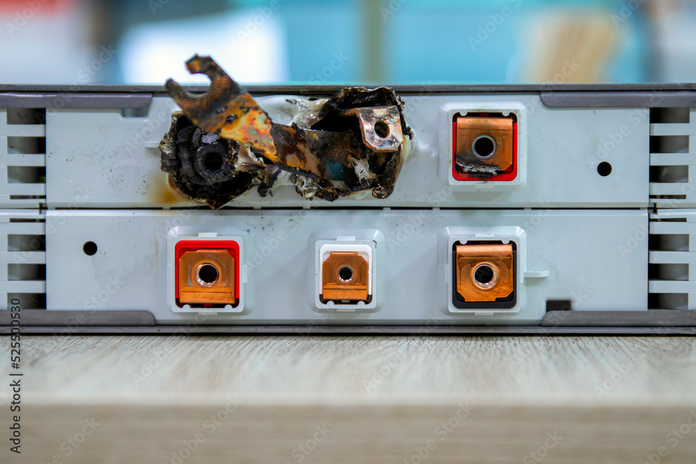 Lithium battery cell with shortcircuited and melted terminals . Stock Photo Adobe Stock