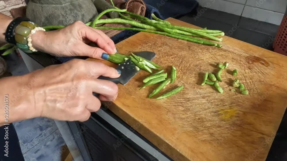 The chef uses a kitchen knife to cut the lentils. The chef uses a kitchen knife to cut the lentils.