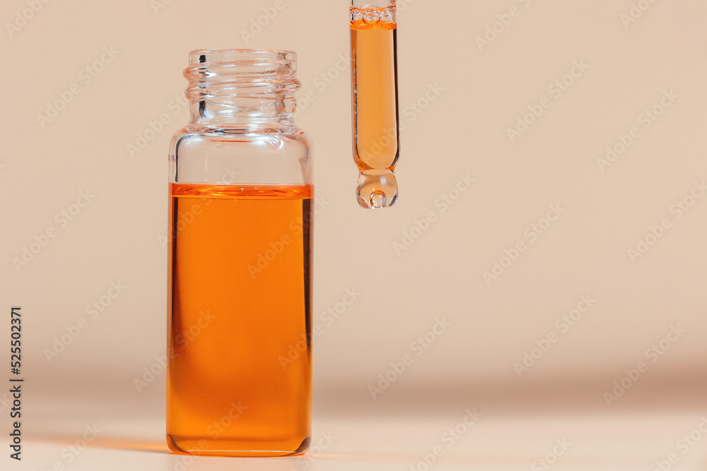 Pipette with a glass bottle on a light background. Pipette with a glass bottle on a light background.