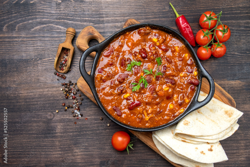 Bean and corn soup or ragout, red bean stew on a wooden background. Food Protein Vegan dish Bean and corn soup or ragout, red bean stew on a wooden background. Food Protein Vegan dish