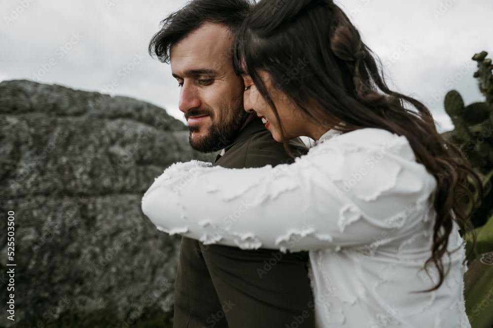 Tender couple of newlyweds embracing in nature Tender couple of newlyweds embracing in nature