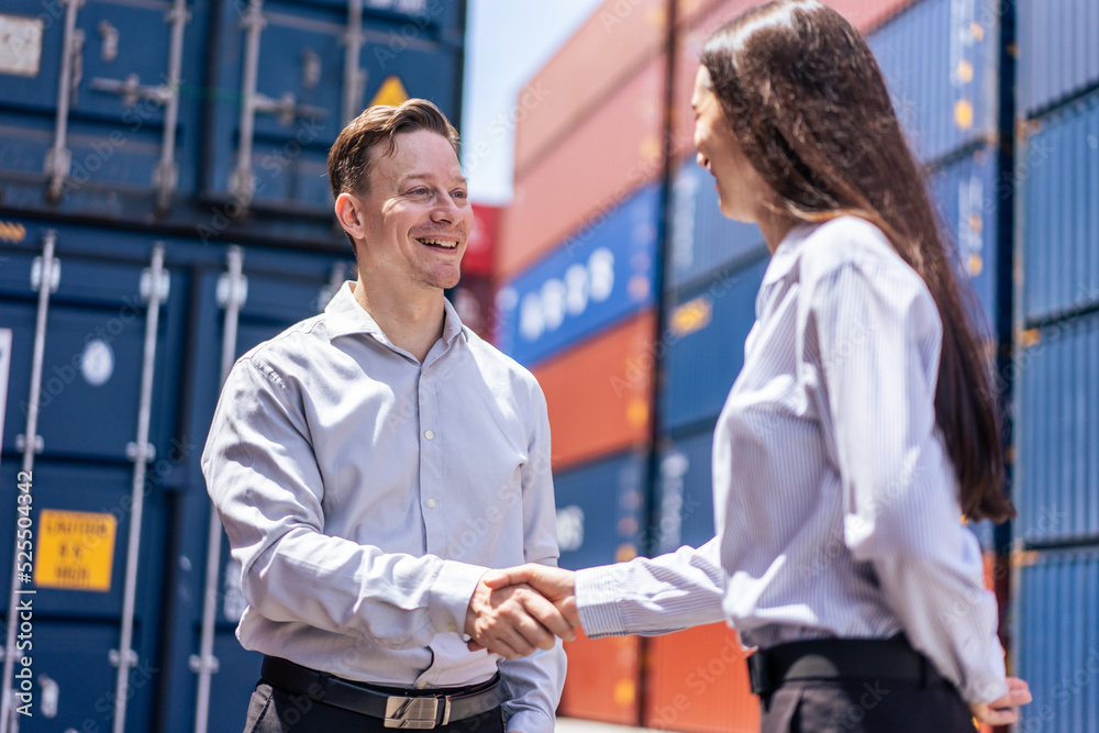 Obraz premium Caucasian businesswoman and businessman worker wor in container port
