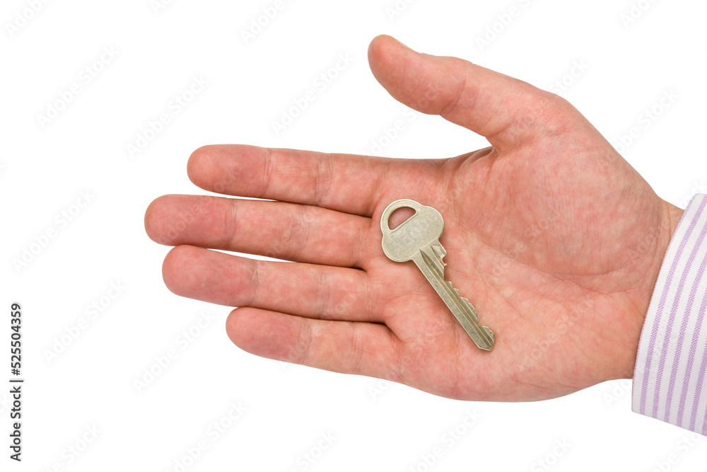 Human hand holding key and giving it away Human hand holding key and giving it away