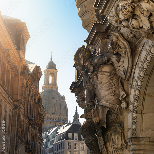 Sculpture of a statue of a warrior at the George Gate or Georgentor or Georgentor, in the background Church of our Lady or Frauenkirche. Dresden, Saxony, Germany photo