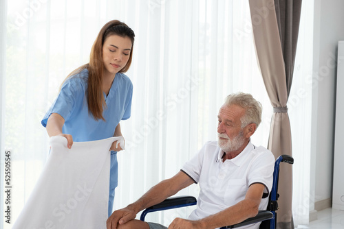 Nurse doctor senior care caregiver help assistence retirement home nursing elderly health. Elderly man with caregiver in nursing home. happy senior man. concept of caring for the elderly at home.