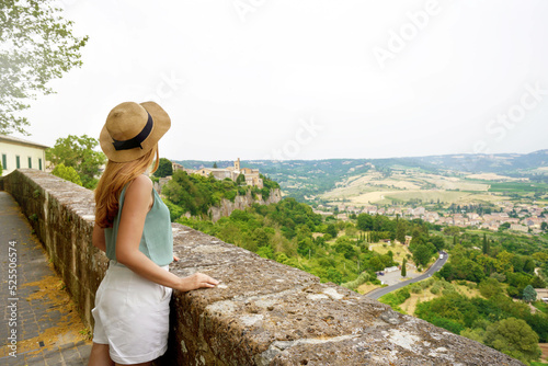 Traveler girl enjoying view of Umbria hills from Orvieto town, Italy