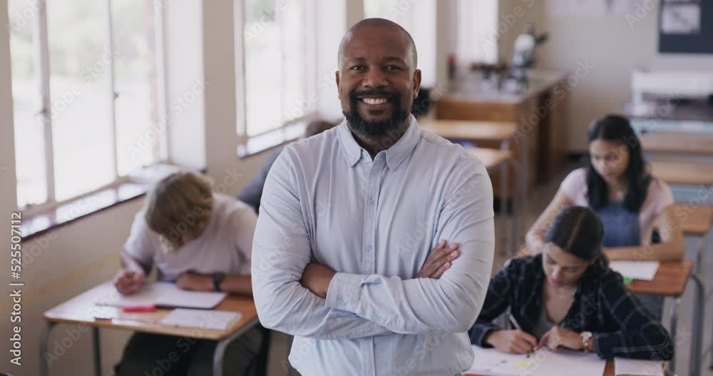Learning, education and a happy man or teacher teaching a class of scholarship students or kids. Classroom, school or college with children studying, study or writing a test or doing work at a desk