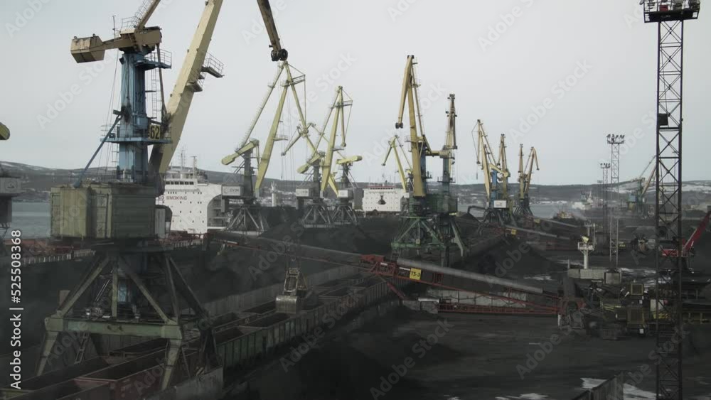 Sea vessels for transport of coal are loaded in sea port with help of huge cranes and conveyor belts. Wagons brought raw materials from field Sea vessels for transport of coal are loaded in sea port with help of huge cranes and conveyor belts. Wagons brought raw materials from field
