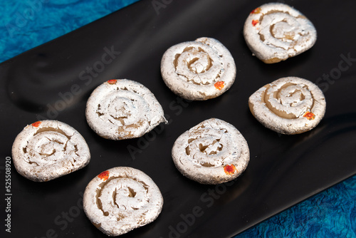 Indian Mithai Kaju Jalebi Also Known As Kaju Katli, Kaju Dilkhush Is Spiral Shaped Sweet Made Of Cashew Nut Powder, Kajoo, Mawa, Mava, Malai, Khoya, Doodh, Badam, Khoa, Badaam, Pista In Sugar Syrup photo