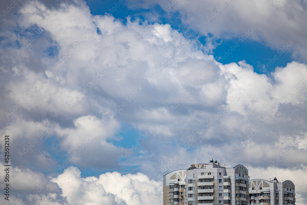upper floors of the house against the cloudy sky upper floors of the house against the cloudy sky