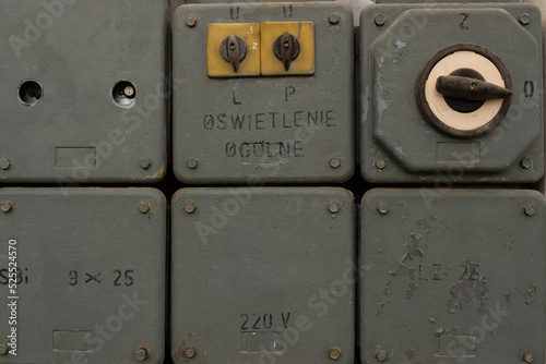 Fotografija A set of old, unused cabinets with switches and electric fuses.