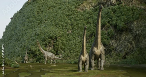 Groups of brachiosaurs, triceratops and a flock of pterosaurs moving through a canyon 3D rendering. photo
