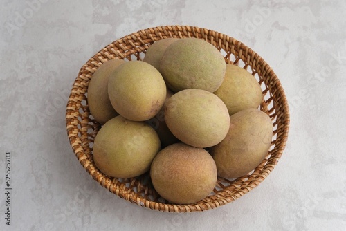 Sapodilla fruit (Manilkara zapota) and other names such as sapota, chikoo, chico, sawo, naseberry, or nispero. photo
