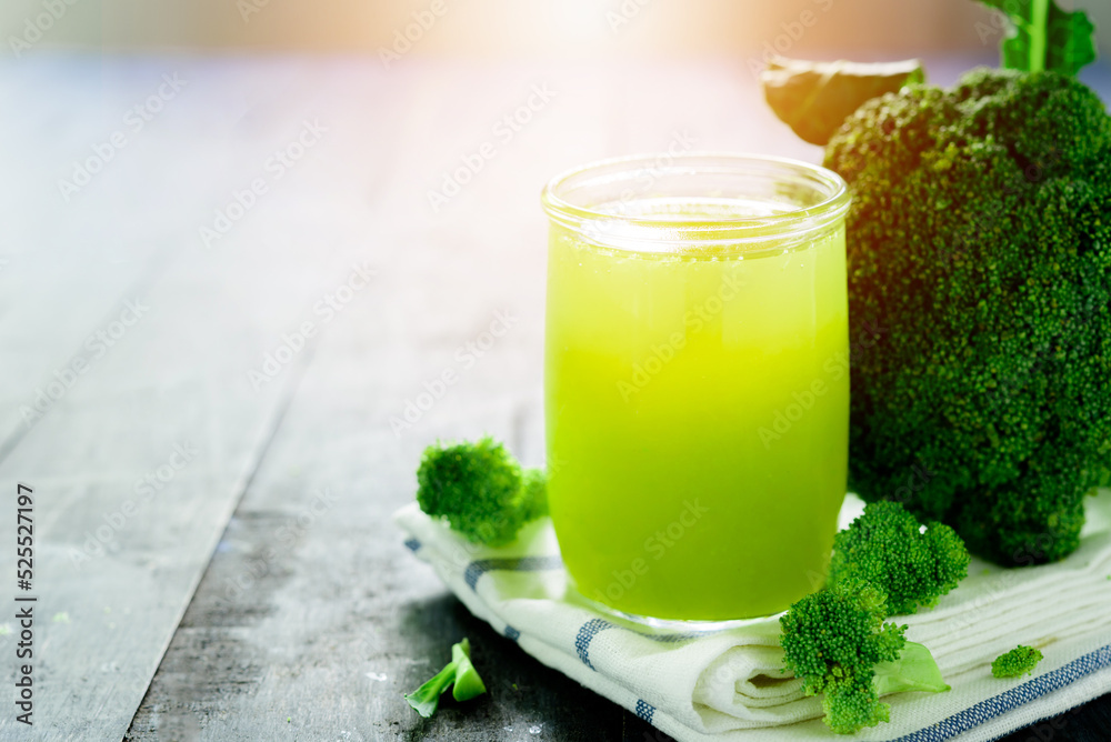 Glass of broccoli juice, broccoli Healthy drink on wood back ground Glass of broccoli juice, broccoli Healthy drink on wood back ground