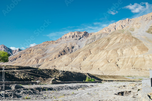 dry arid landscape of mountains in Spiti Valley of Kaza on a sunny summer day in India