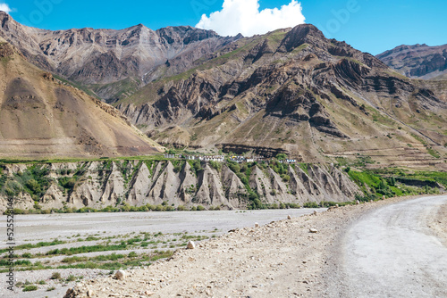 village in Pin Valley of Himachal Pradesh in India surrounded by enormous Himalayan Mountains