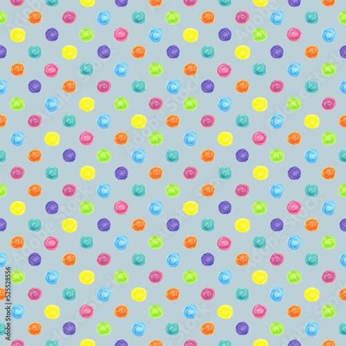 Seamless pattern bright colorful dots drawn with wax crayons on a blue grey background. For fabric, sketchbook, wallpaper, wrapping paper.