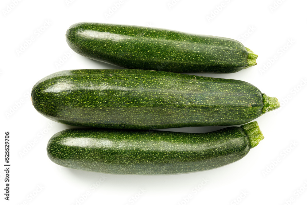 Three ripe green zucchini on a white background, zucchini vegetables. Three ripe green zucchini on a white background, zucchini vegetables.